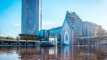 blue and white concrete building near body of water during daytime