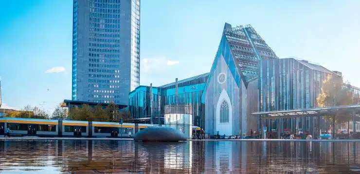 blue and white concrete building near body of water during daytime